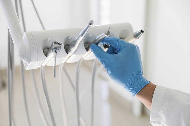 Professional Tooth Extraction technician working in Greenville, TX